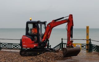 digger on Brighton beach