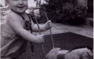 small child with pushalong doneky