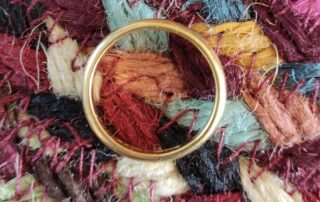wedding ring on mat in shape of O